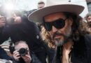 Russell Brand, bible in hand, pleads not guilty to new rape and sexual assault charges