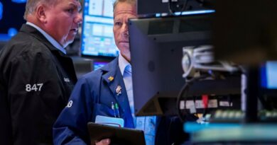 Dow slides nearly 800 points as AI and tariff risks rattle investors